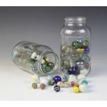 A quantity of marbles of various sizes, Victorian and later, to two glass jars (Qty)