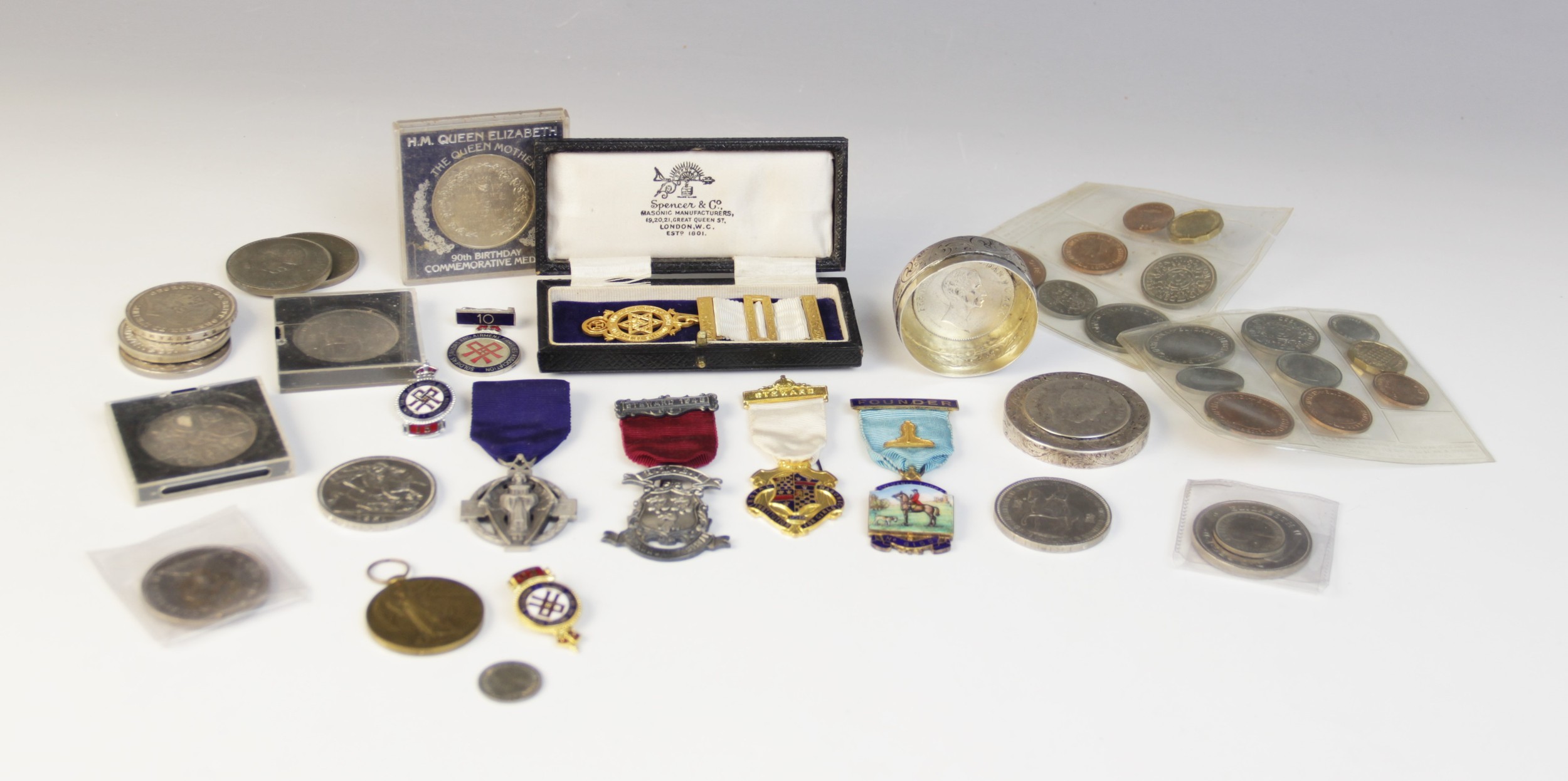 A selection of coins and medallions, to include a silver box inset with European coins, assorted