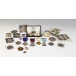 A selection of coins and medallions, to include a silver box inset with European coins, assorted