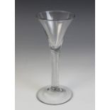 A conical wine or cordial glass, the bowl on single series multi-strand mercury or air twist stem