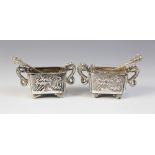 A pair of Chinese silver salts, each of rectangular form with scalloped corners raised on four feet,