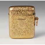 A Victorian 9ct gold vesta case, Thomas Acott & Co, Birmingham 1894, the rectangular body embossed