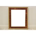 A late 19th century rectangular rosewood and gesso wall mirror, the outer frame with repeating shell