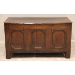 An 18th century and later oak coffer, the moulded three plank top opening to a later constructed