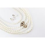 A cultured pearl necklace with a 9ct gold garnet and pearl set clasp, 48cm long, together with a