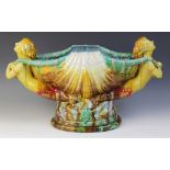 A continental majolica table centrepiece of large proportions, 19th century, modelled as mermaids