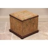 A 19th century mahogany and upholstered ottoman, of cubic form, covered in foliate fabric, with a