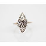 A Victorian style diamond set ring, the pierced navette shaped head set with brilliant cut diamonds,