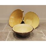 Three 19th century confit or dairy bowls, each with a glazed interior, the two largest with
