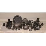 A collection of pewter items, 18th century and later, to include two domed food covers, the