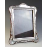 A George V silver frame, J & R Griffin Ltd, Chester 1913, the flowing rectangular form decorated