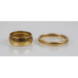 A 22ct gold wedding band, marks for Birmingham 1915, size H, together with a further 22ct gold