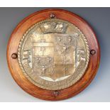 A bronze heraldic plaque, cast in relief with the coat of arms for Brecknockshire, below a coronet