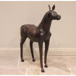 A leather covered model of a horse, late 20th century, realistically modelled with head and tail