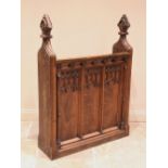 A Victorian oak church lectern, the sloping book rest supported on a pair of gothic ogee uprights