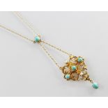 An Edwardian style pendant, the openwork scrolling pendant set with turquoise coloured cabochons and