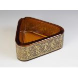 A Moser Karlsbad amber glass ashtray, of triangular form and decorated in silvered relief with a