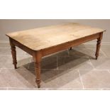 A Victorian scrub top pine kitchen table, the rectangular table top with rounded corners, raised