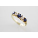 An early 20th century diamond and sapphire five-stone ring, comprising three mixed cut sapphires