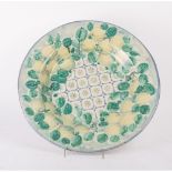GRANDE FANGOTTO in ceramica smaltata e decorata a motivo naturalistico. S. Stefano di Camastra