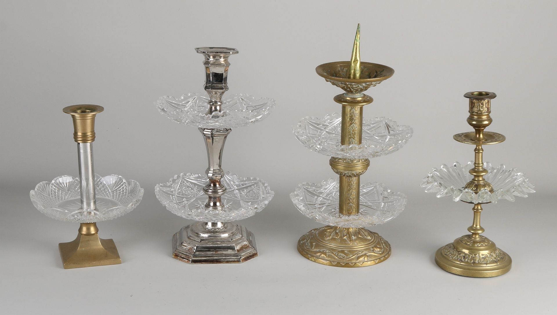 4x Old candlesticks with tiers