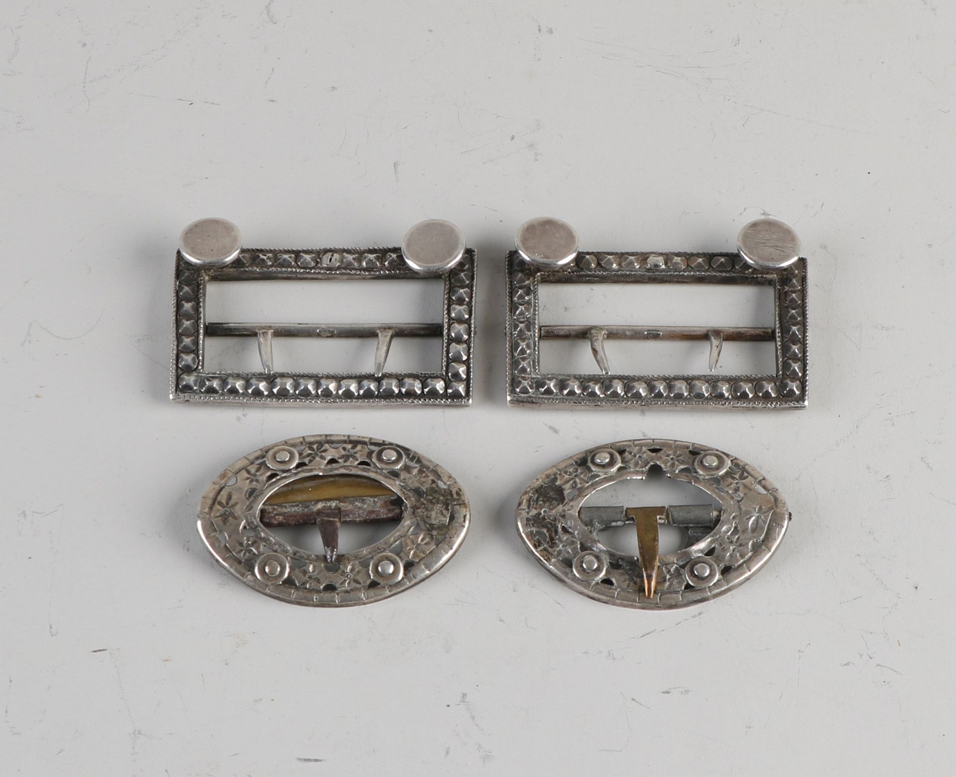 Pair of silver buckles and pair of calf buckles