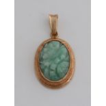 Gold pendant with jade