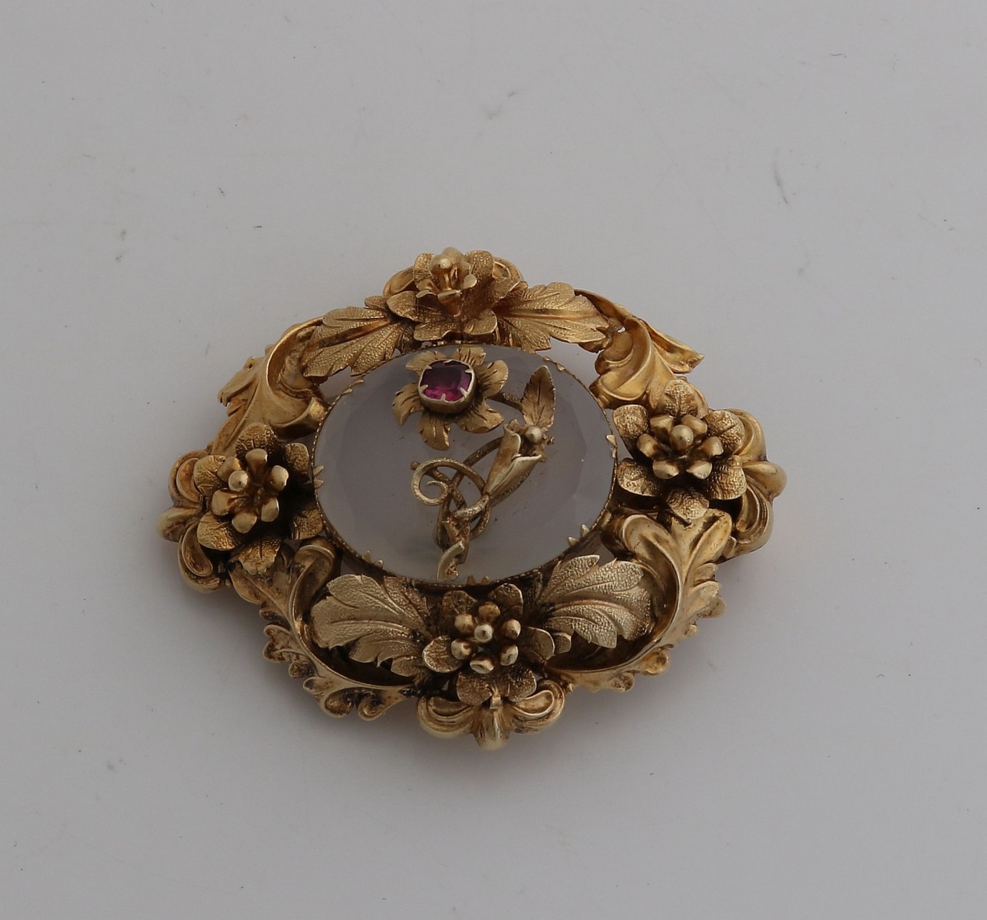 Gold pendant / brooch with red stone