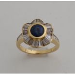 Gold ring with diamond and sapphire