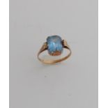 Gold ring with blue stone