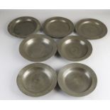 Seven antique pewter plates