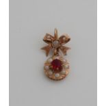 Gold pendant with pearl and red stone