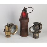 Three antique (carbide) lamps