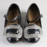 Pair of traditional dress shoes with silver buckles