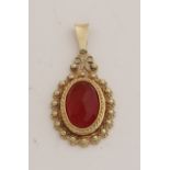 Gold pendant with carnelian