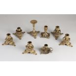 Eight brass candlesticks