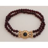 Garnet bracelet with gold.