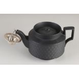 Basaltware teapot with silver tea strainer
