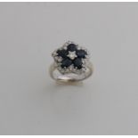 White gold ring with diamond and sapphire