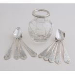 Spoon vase with silver spoons