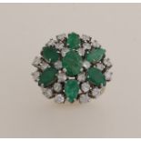 White gold ring with diamond and emerald