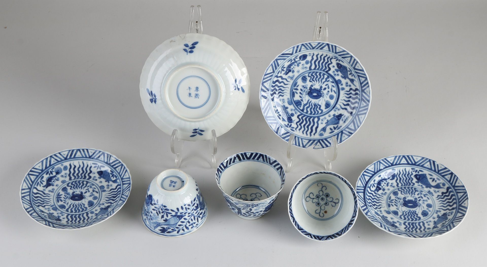 Three Chinese cups and saucers