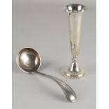 Silver spoon and vase