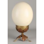 Real ostrich egg on standard