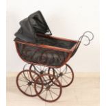 Doll pram with porcelain handle.