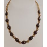 Gold necklace with garnet
