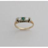 Gold ring with emerald and diamond