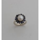 White gold ring with pearl and sapphire