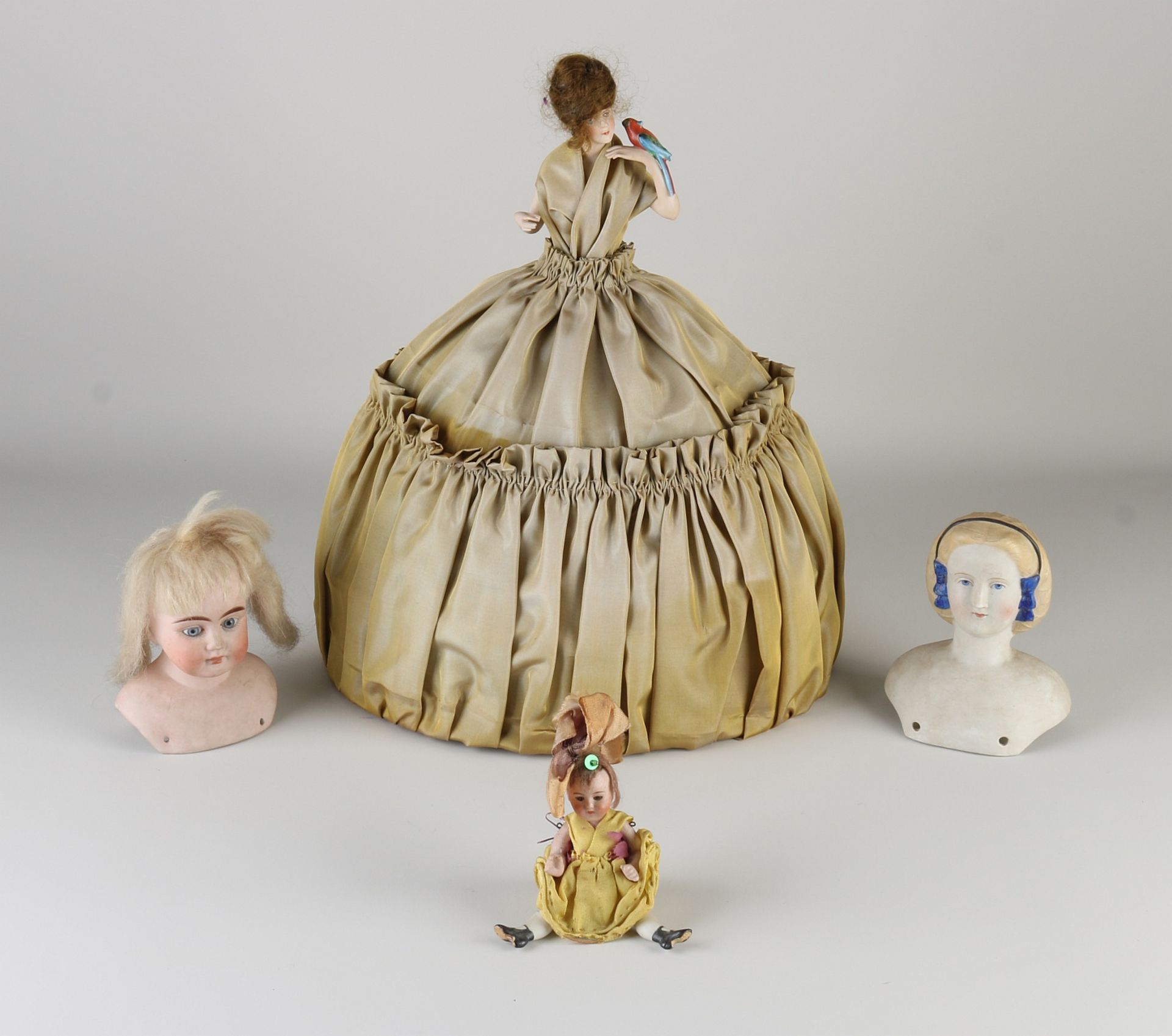 Three German porcelain dolls + tea cozy