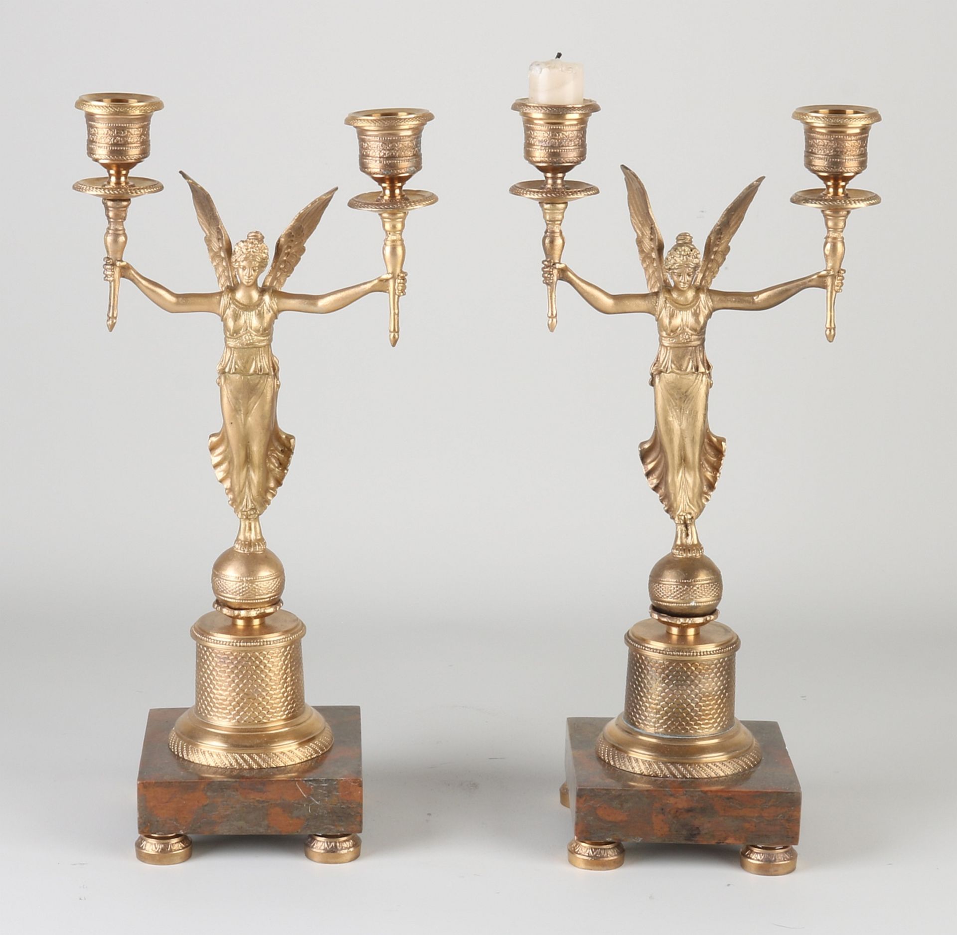 Two bronze empire style candlesticks